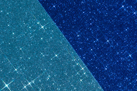 sparkling christmas texture. Abstract light and dark blue background with sparkles in the shape of stars. Festive backdrop for your projects.の写真素材