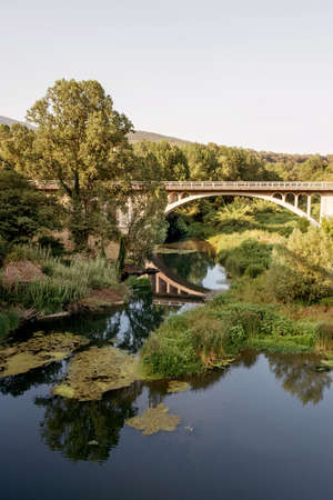 Bridge over the lake in the mountains.の写真素材