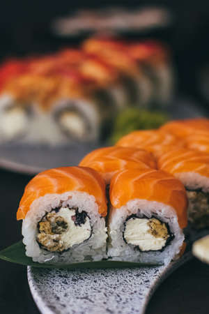 Sushi with salmon, cream cheese Philadelphia, cucumber and wasabiの写真素材