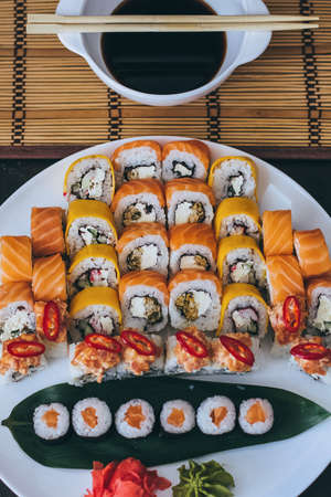 Sushi with salmon, cream cheese Philadelphia, cucumber and wasabiの写真素材