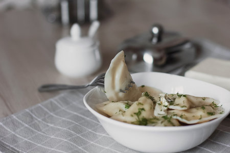 Dumplings, filled with potatoes and served with butter and fennel. Varenyky, vareniki, pierogi, pyrohy. Dumplings with fillingの写真素材
