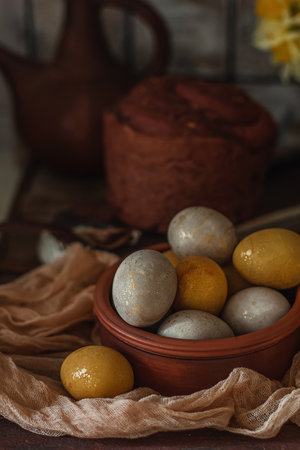 Natural dye for Easter eggs - turmeric on vintage wooden backgroundの写真素材