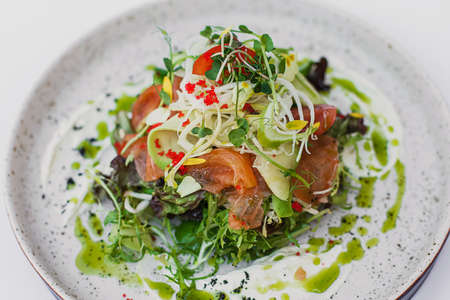 Smoked salmon salad, with mixed greens, avocado, grapefruit. Delicious healthy eatingの写真素材