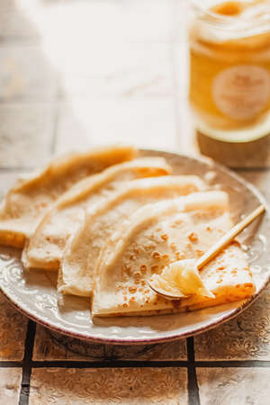 Ghee butter in glass jar and pancakes on table. Healthy eating, breakfastの写真素材