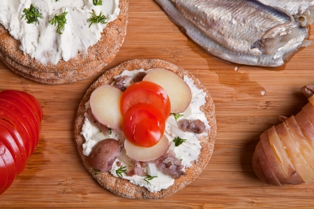 Sandwich with swedish herring on the tableの写真素材