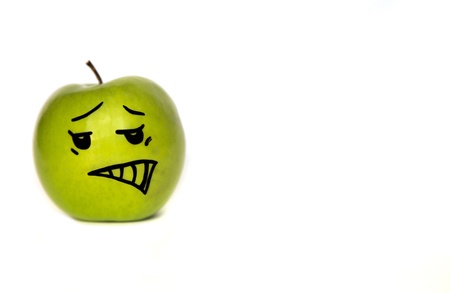 Cartoon-faced apple on whiteの写真素材