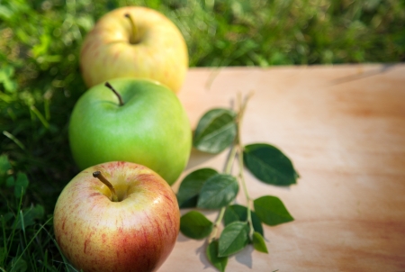 Three apples on woodの写真素材