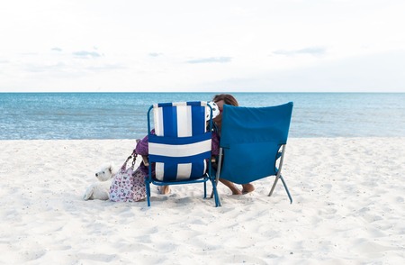 Happy Romantic Couple Enjoying Beautiful Sunset at the Beachの写真素材