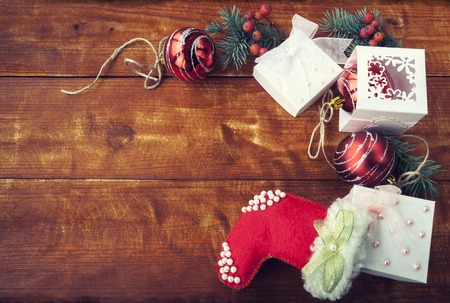 Christmas Composition with red balls on wooden table.の写真素材