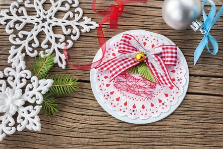 Christmas card with Christmas decorations on wooden backgroundの写真素材