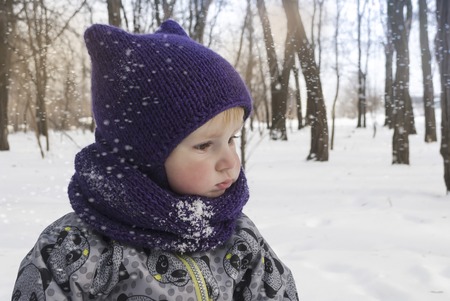 little boy in a winter park