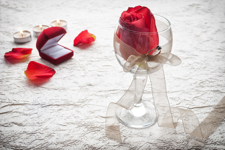 Artistic photo of beautiful rose in a wineglass.の写真素材
