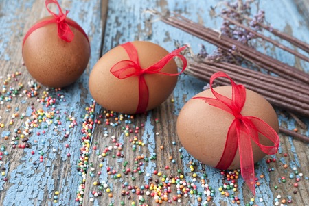 Easter egg decorations on wooden backgroundの写真素材