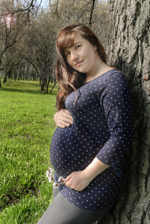 portrait of beautiful woman in the flowering parkの写真素材