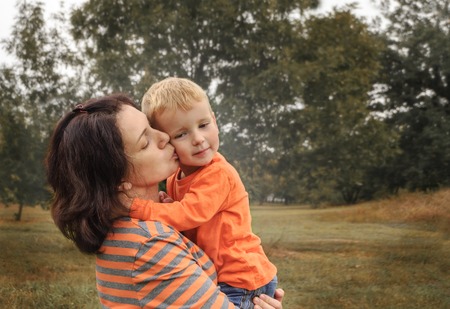 Mom and little son in the park. Concept happy childhood. Copyspace.の写真素材