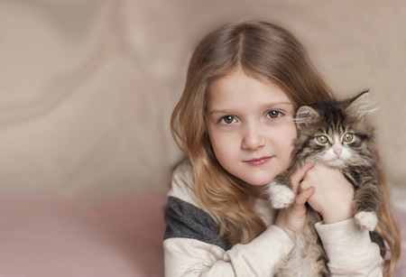 portrait of a little girl with a kittenの写真素材