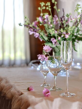 Wine glasses on a table in a restaurantの写真素材