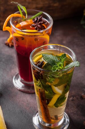 Two glasses of tea with fruits and spices. Hot drinksの写真素材