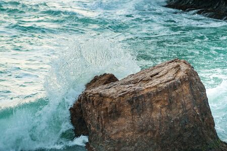 Waves are breaking on stones. Storm at seaの写真素材