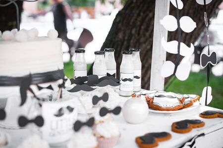 Candy bar at Birthday party. Style little gentleman. Black white colorの写真素材