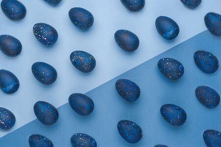 trendy Easter egg pattern of color of the year-classic blue with gradient effect. Flatley. Top view