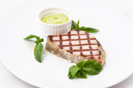 Grilled beef with basil leaves isolated on white background.の写真素材