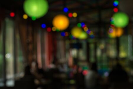 Lights in a cafe in the evening. Blurred background, copy space for display of product or object presentation. Vacation conceptの写真素材