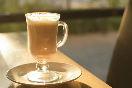 Morning coffee in a coffee shop with sunlight. Good morning conceptの写真素材