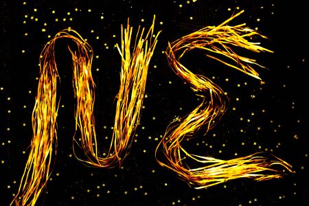 Christmas lettering for overlay. Shiny gold Christmas background. Background for holiday cards. Blur