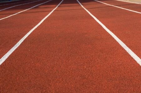 Running track in the stadium. Rubber coating. Treadmill in the fresh air. Healthy lifestyle concept....