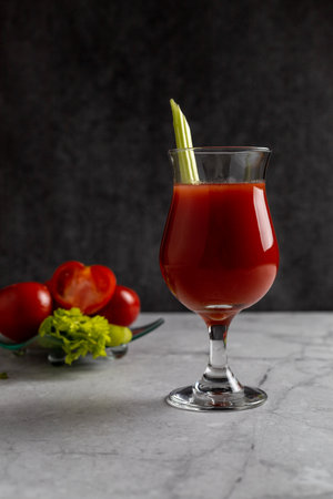 Glass of homemade tomato juice with celery stick. Healthy beverages.の写真素材