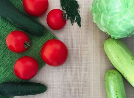 flatlay vegetable harvest, tomatoes, zucchini, cucumbers, cabbageの写真素材