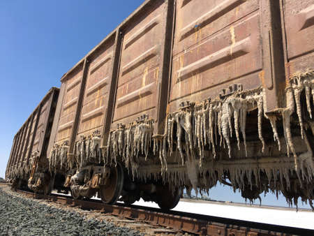cars with salt stalactites on the salt lake