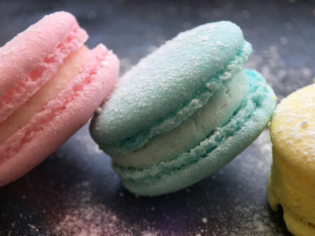 Colorful macaroni cookies, macaroni cake or macaroni cookies on a pink background. macro photo