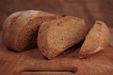 Round loaf bread with some slices cut