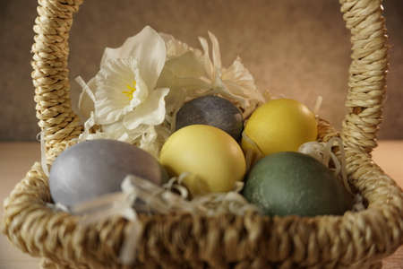 colorcolorful eggs for easter in a wicker straw basketful eggs for easter in a wicker straw basket