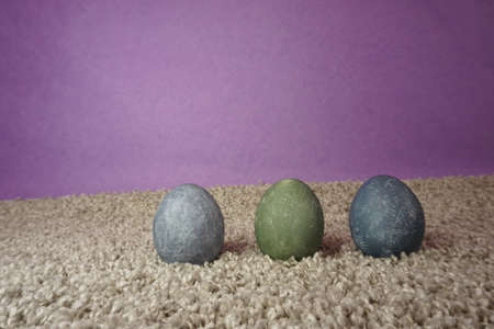 colorful eggs for easter on a gray fleecy surface