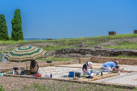 Santiponce (Sevilla), Spain, May 4, 2017. Restorers restore the mosaic on the ruins of the ancient roman city of Italica.のeditorial素材