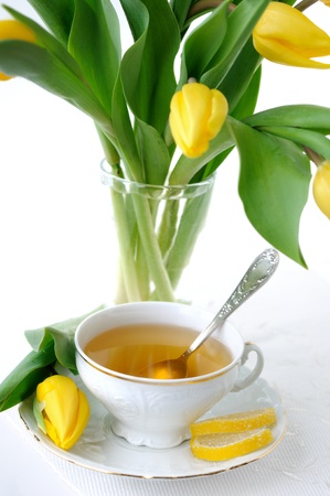 Yellow tulips and tea の写真素材