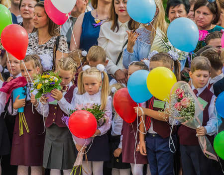 Minsk, Belarus - September 1, 2018 First-graders with flowers and balloons at the festive meeting on September 1のeditorial素材