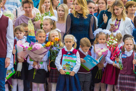 Minsk, Belarus - September 1, 2018 Solemnly dressed first-graders with donated books on their first day of schoolのeditorial素材
