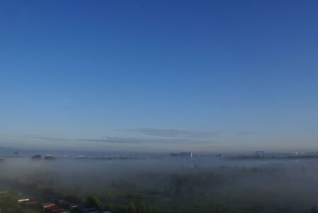 Top view of the blue clear sky the city in the morning fogの写真素材