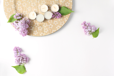 minimalistic composition on a white background. branches of fresh lilac flowers are photographed from the top. summer conceptの写真素材
