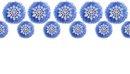 Beautiful Christmas decorations in blue in the form of balls decorated with snowflakes. layout in the form of a decorative frame with space for text. flat lay, seamless pattern on white backgroundの写真素材