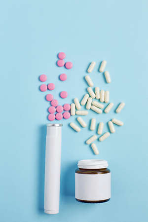 creative medicine compositions. two types of drugs in the form of capsules and tablets on a gradient...