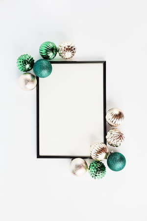 festive banner. black frame with blank white background for text. christmas decor green and gold, flat lay, copy space.の写真素材