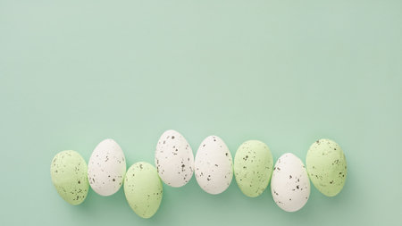 Happy Easter banner. Easter decor in pastel colors in the form of spotted eggs on a light blue...