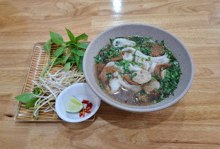 Vietnamese vegetarian pho with tofu, mushrooms, and noodles in a light broth, viewの写真素材