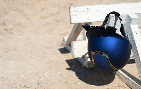 Euro riding helmet. Gloves for horse riding. Equestrian equipment. Sports. Summer. The sun. Banner. Outdoors. Close-upの写真素材