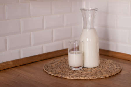 Happy Day of Milk. Milk jug and glass on light backgroundの写真素材